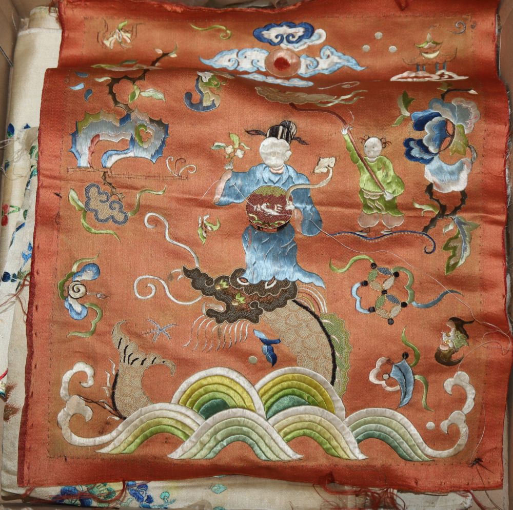 Two pairs of Chinese embroidered panels, embroidered on cream silk with all over multi-coloured birds, butterflies, fish and flowers an